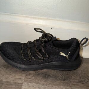 Puma Black Tennis Shoes with Subtle Gold Details